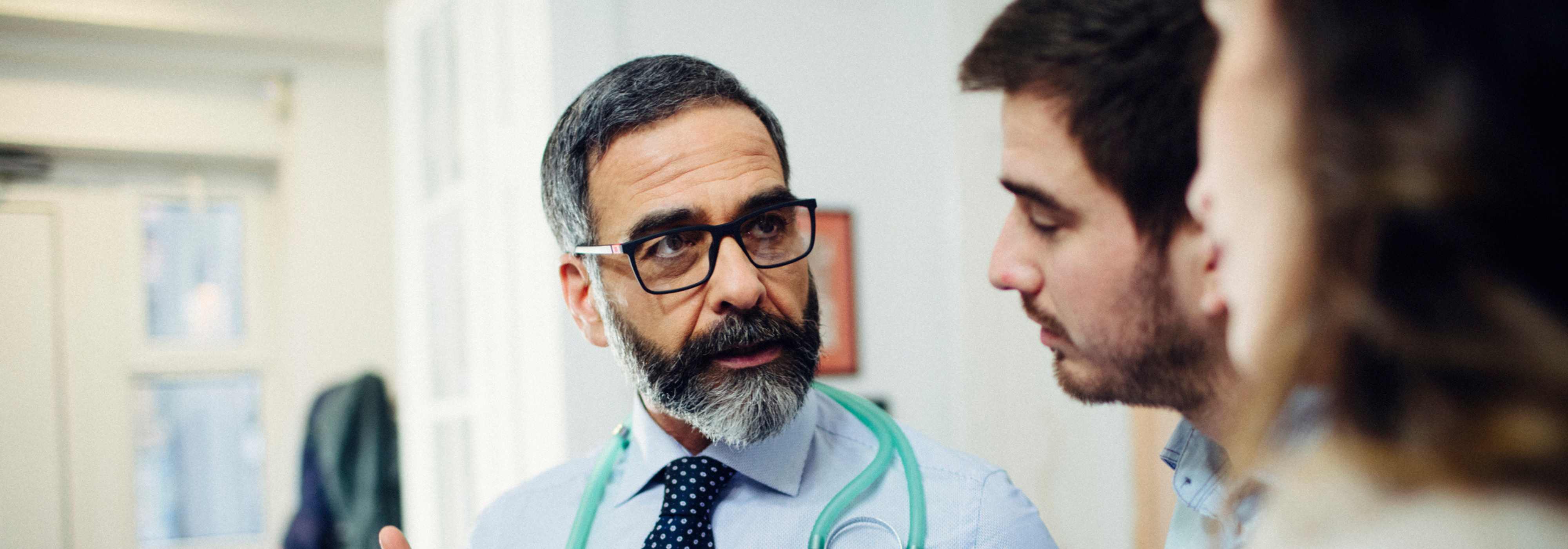 Doctor speaking with patients.