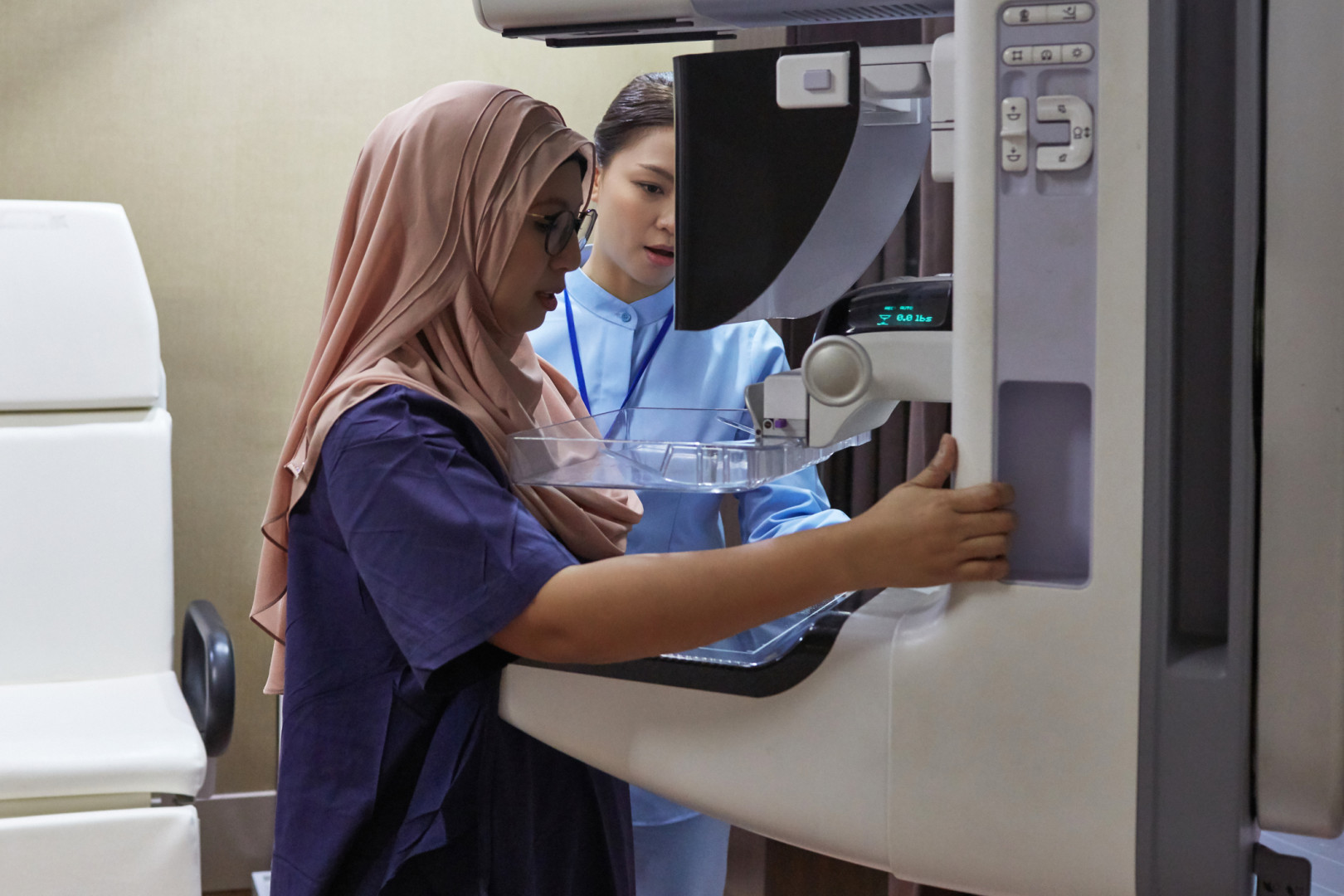 Woman having a mammogram.