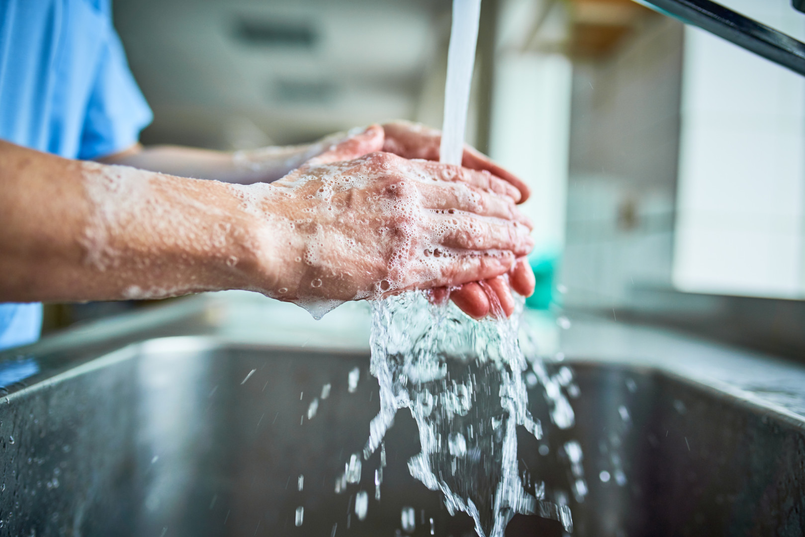 Health professional washing hands