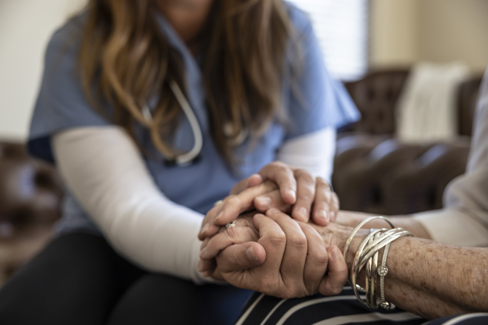 Nurse and patients' hands.