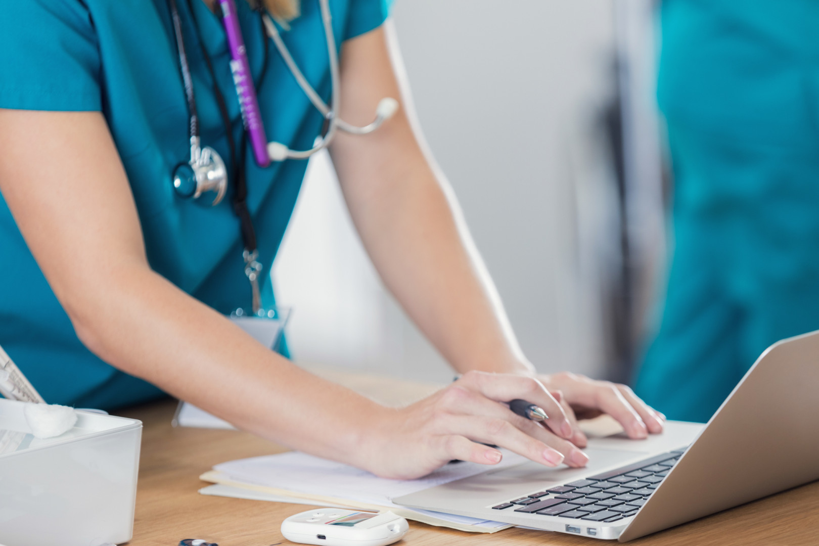 Nurse using laptop.